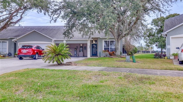 ranch-style home featuring a garage and a front lawn