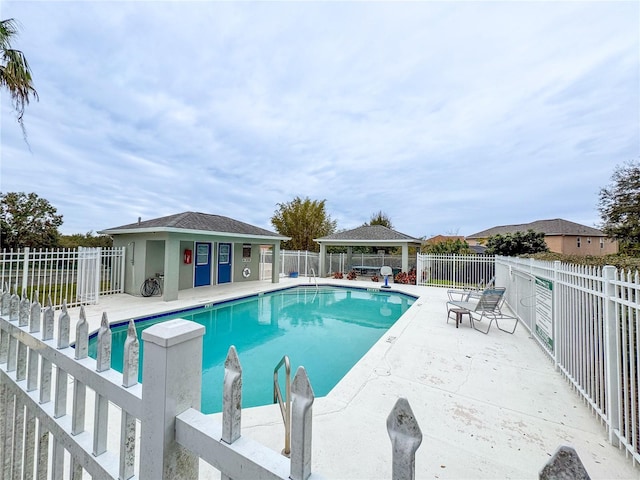 view of swimming pool featuring a gazebo and a patio