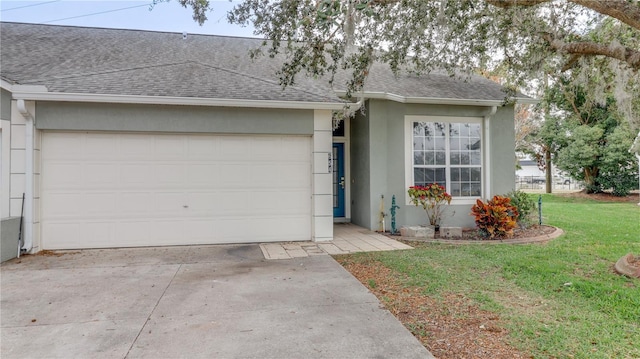 ranch-style home with a garage and a front lawn