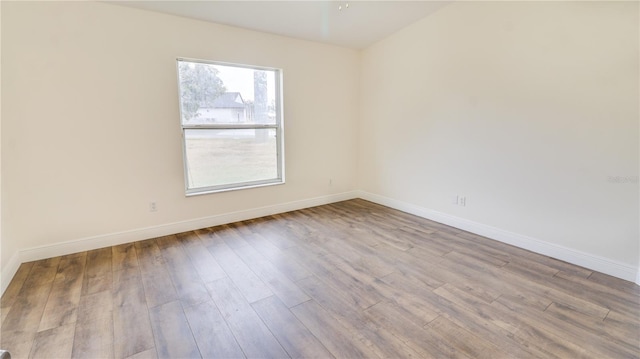 unfurnished room featuring light wood-type flooring