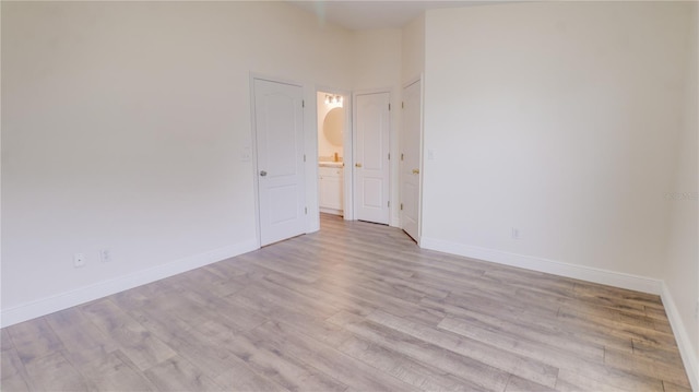 spare room with light wood-type flooring