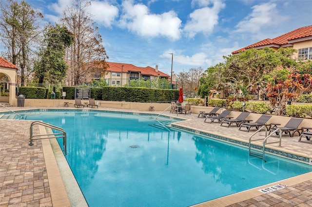 view of swimming pool featuring a patio area