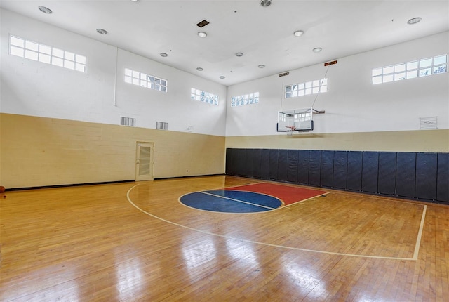 view of sport court with community basketball court and plenty of natural light