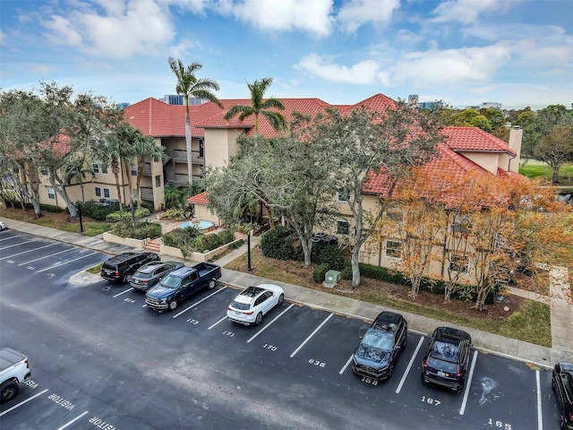 view of property with uncovered parking