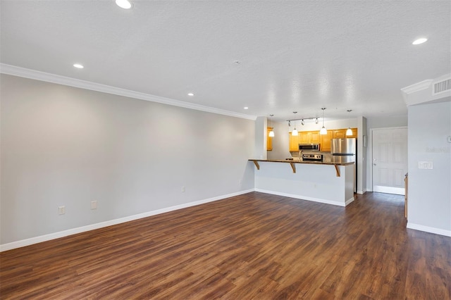 unfurnished living room featuring a textured ceiling, recessed lighting, baseboards, dark wood finished floors, and crown molding