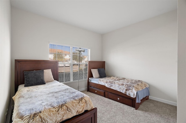 bedroom featuring light carpet