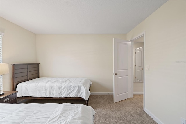 bedroom featuring light colored carpet