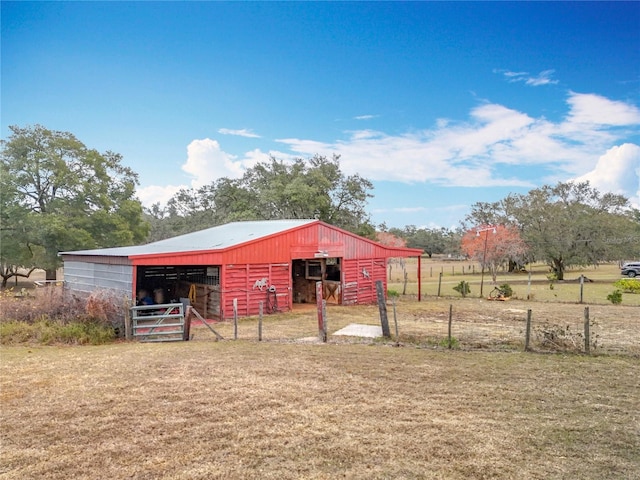 view of outbuilding with a rural view