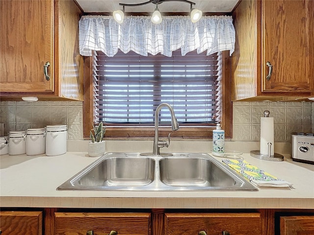 kitchen featuring decorative backsplash and sink