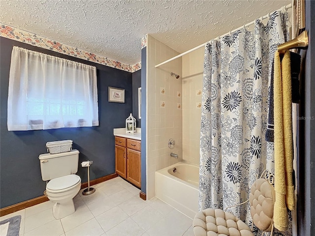 full bathroom featuring toilet, shower / tub combo with curtain, tile patterned floors, a textured ceiling, and vanity