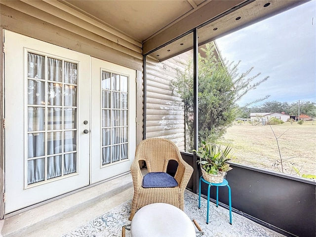 sunroom / solarium with plenty of natural light and french doors