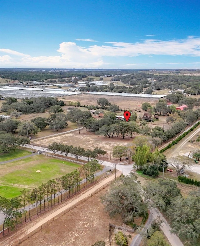 birds eye view of property featuring a rural view