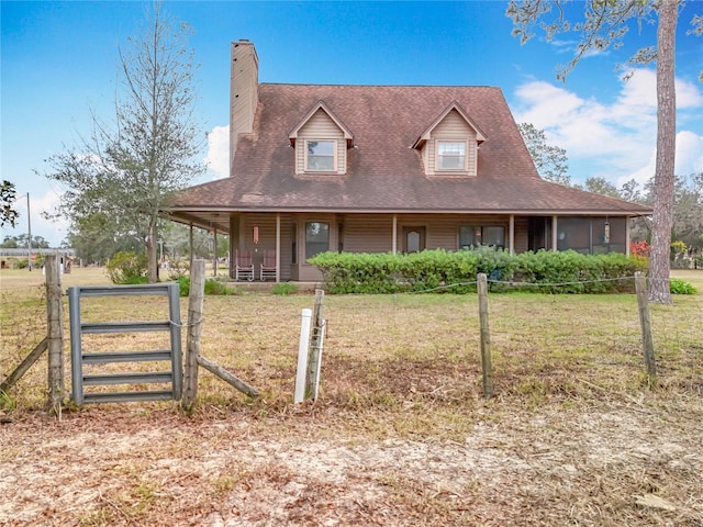 farmhouse with a front lawn