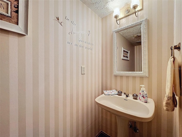 bathroom with a textured ceiling