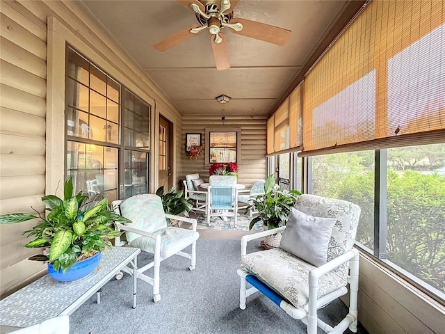 sunroom / solarium featuring ceiling fan and plenty of natural light