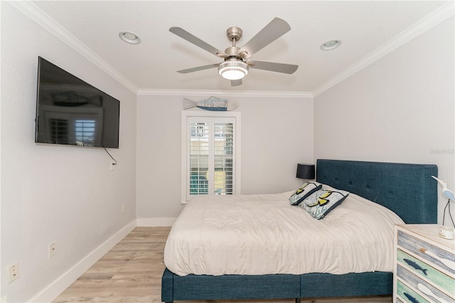 bedroom featuring ceiling fan, ornamental molding, and light hardwood / wood-style floors