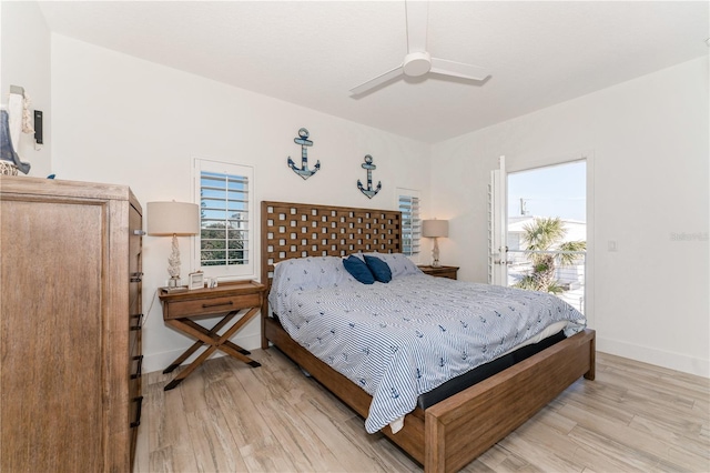 bedroom featuring light wood-type flooring, ceiling fan, and access to outside