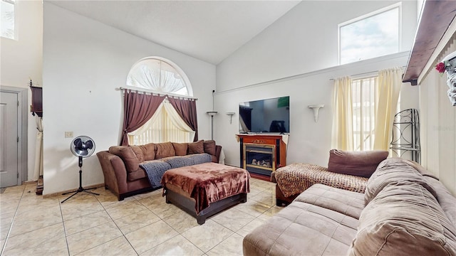 tiled living room with high vaulted ceiling