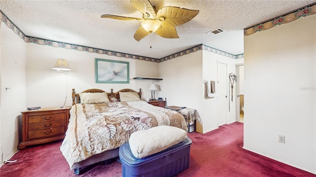 carpeted bedroom featuring ceiling fan and a textured ceiling