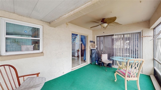 view of patio / terrace with ceiling fan and a balcony