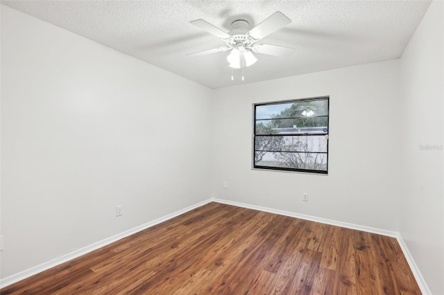 empty room featuring a textured ceiling, ceiling fan, and hardwood / wood-style flooring