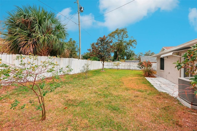 view of yard with central AC unit