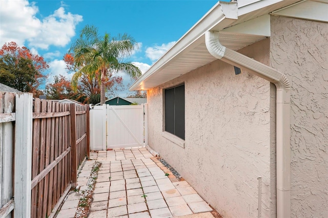 view of property exterior with a patio