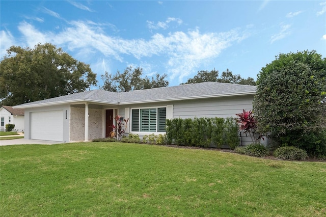 ranch-style house featuring a front lawn and a garage