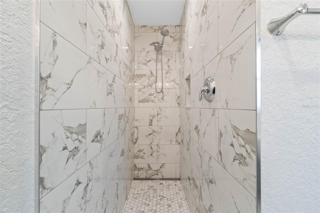 bathroom featuring tiled shower