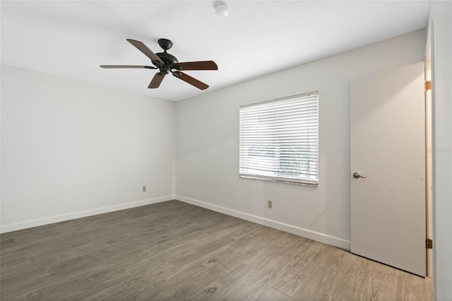 empty room featuring ceiling fan and wood-type flooring