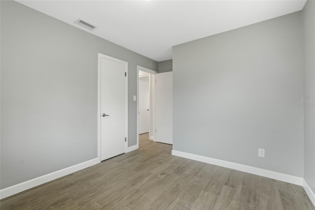 spare room with light hardwood / wood-style flooring