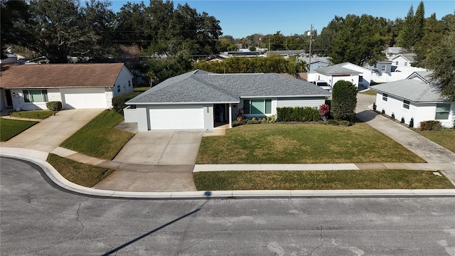 single story home featuring a garage and a front yard