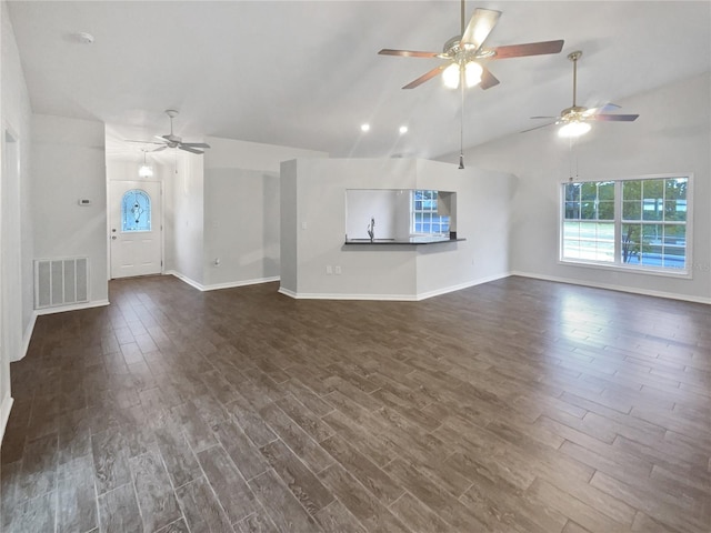 unfurnished living room with lofted ceiling, ceiling fan, and dark wood-type flooring