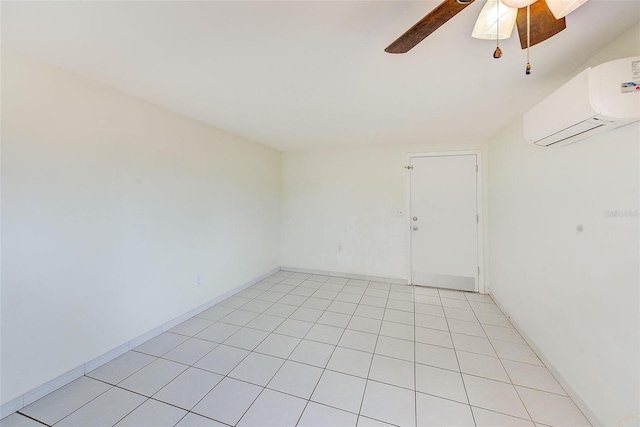 tiled empty room with ceiling fan and a wall mounted AC