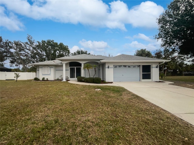 ranch-style home with a front yard and a garage