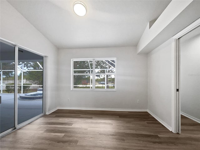 empty room featuring dark hardwood / wood-style flooring