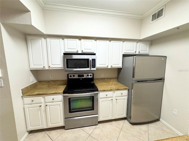 kitchen featuring visible vents, appliances with stainless steel finishes, white cabinets, and ornamental molding