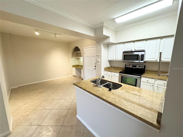 kitchen featuring white cabinets, appliances with stainless steel finishes, light stone counters, ornamental molding, and a sink