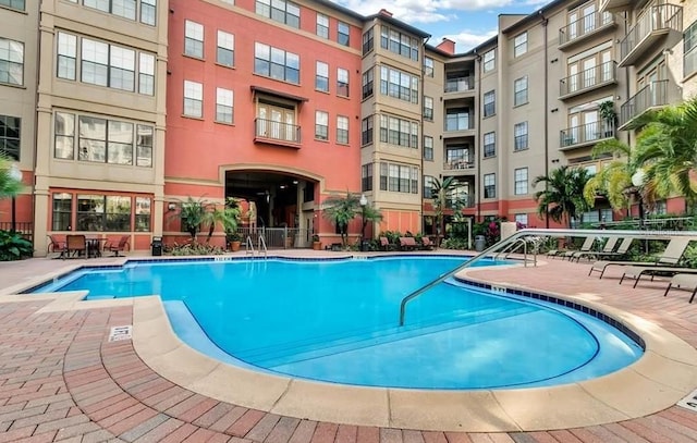 community pool with a patio