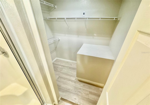 spacious closet with wood finished floors