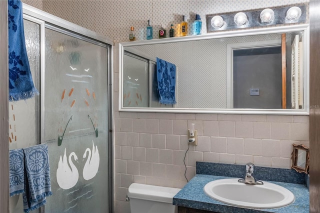 bathroom with walk in shower, vanity, and toilet