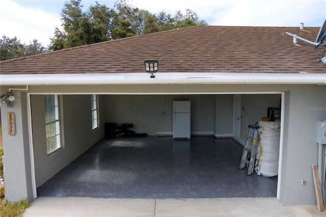 garage featuring white refrigerator