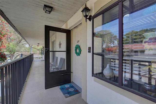 entrance to property with a balcony