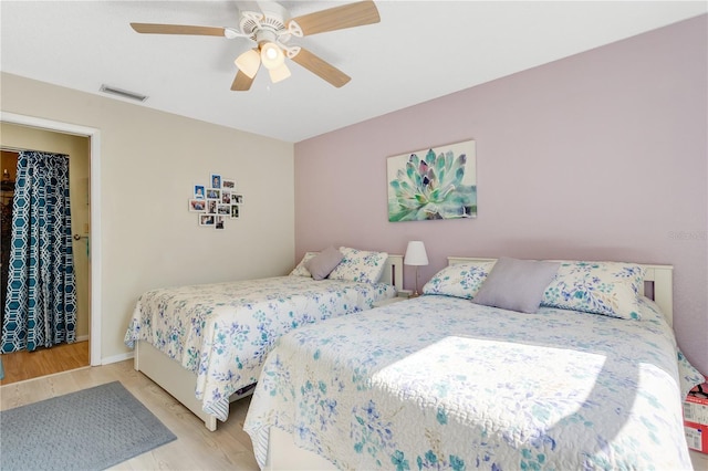 bedroom featuring ceiling fan and light hardwood / wood-style floors