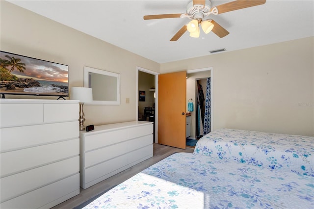 bedroom featuring ceiling fan and light hardwood / wood-style flooring