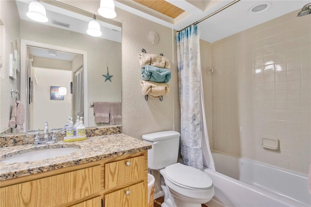 full bathroom featuring shower / bath combo, vanity, and toilet