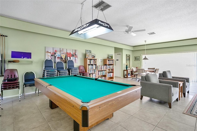 playroom featuring pool table, ceiling fan, and a textured ceiling