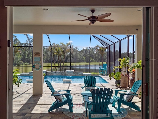 exterior space with a lanai, a patio, and pool water feature