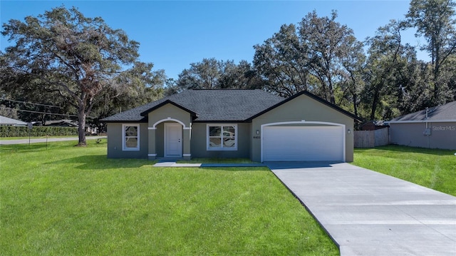 single story home featuring a garage and a front lawn