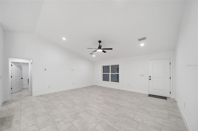 empty room featuring ceiling fan and lofted ceiling